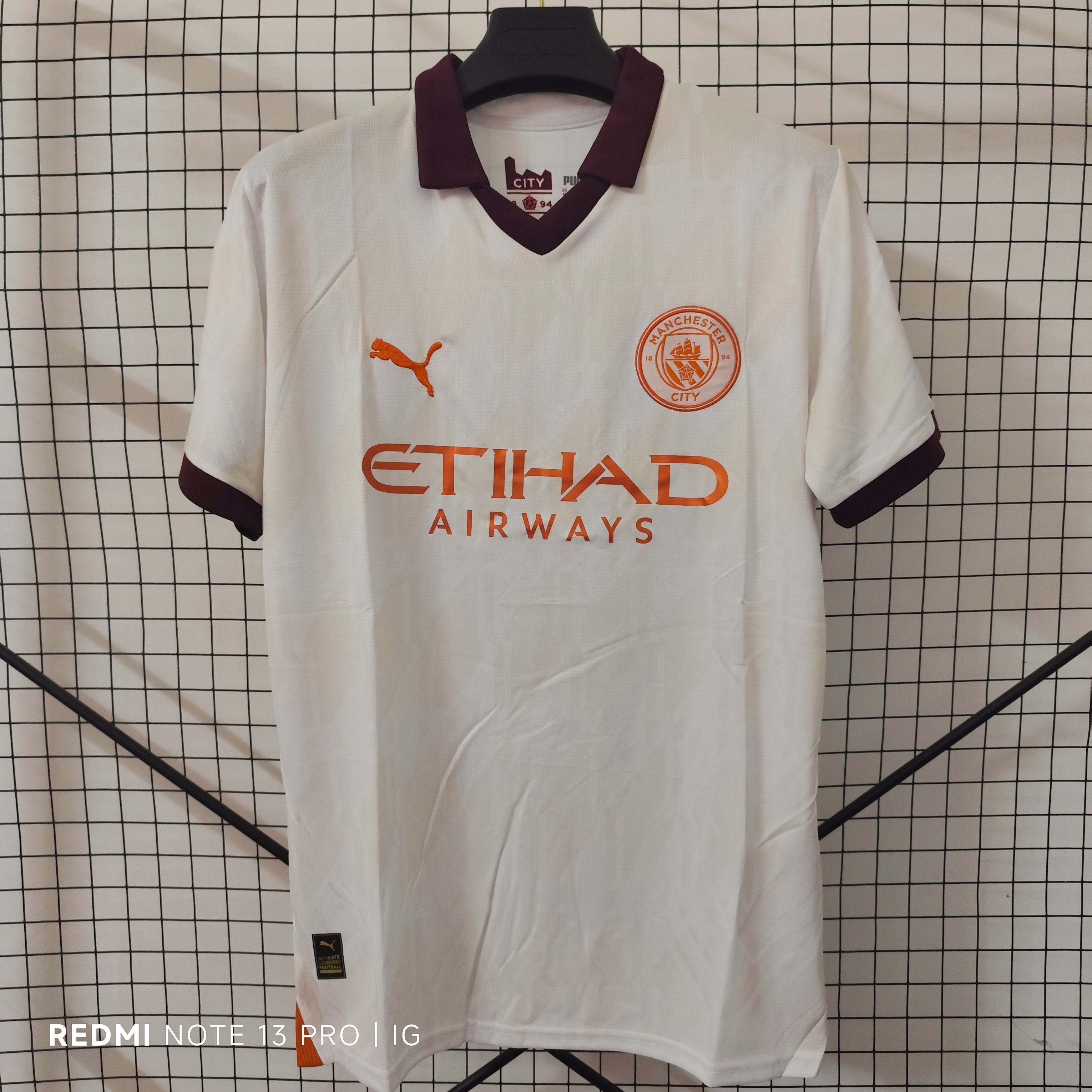23/24 Manchester City Away Jersey - White with Burgundy-Orange Accents & Retro POLO Collar