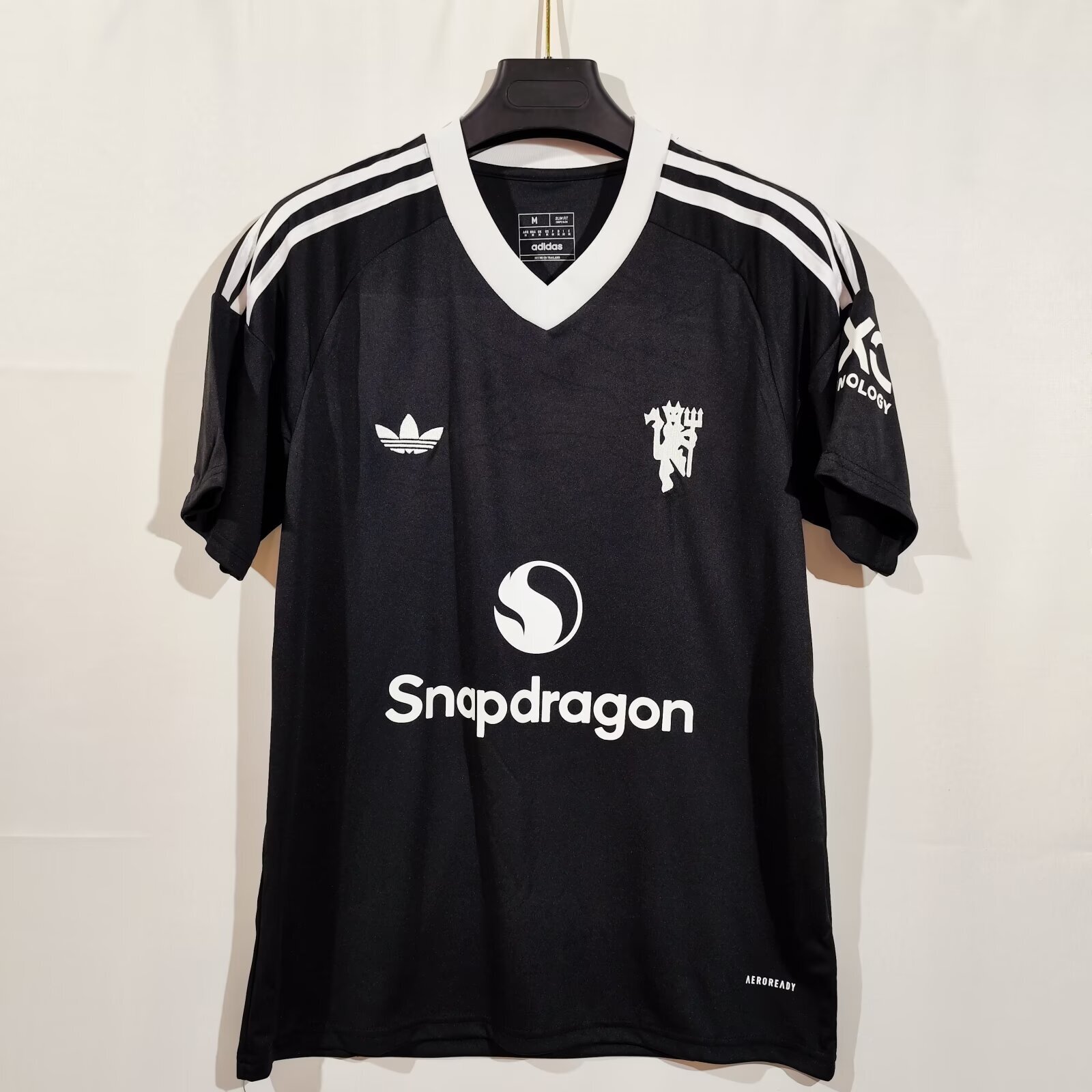 24/25 Manchester United Black Training Jersey - Black with White Retro Trefoil Logo & Minimalist Crest