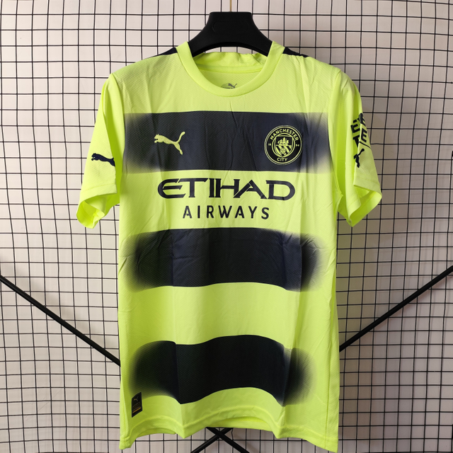 22/23 Manchester City Third Away Jersey - Neon Yellow with Dark Stripes & Gradient Blur Design