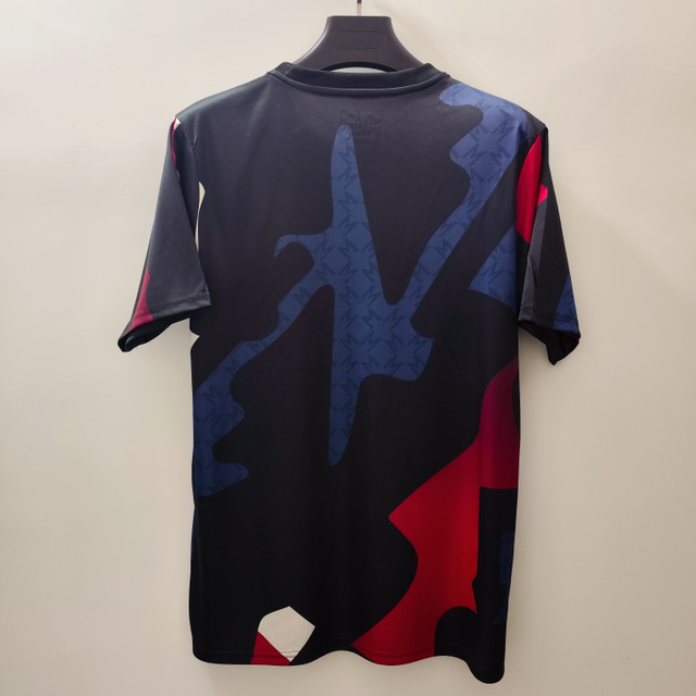 24/25 Manchester United Training Jersey - Black with Red-Blue-White Geometric Pattern & White Accents
