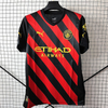 22/23 Manchester City Away Jersey - Black-Red Diagonal Stripes with Gold Accents & Bold Color-Block