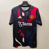 24/25 Manchester United Training Jersey - Black with Red-Blue-White Geometric Pattern & White Accents