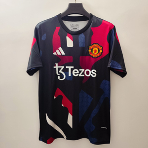 24/25 Manchester United Training Jersey - Black with Red-Blue-White Geometric Pattern & White Accents