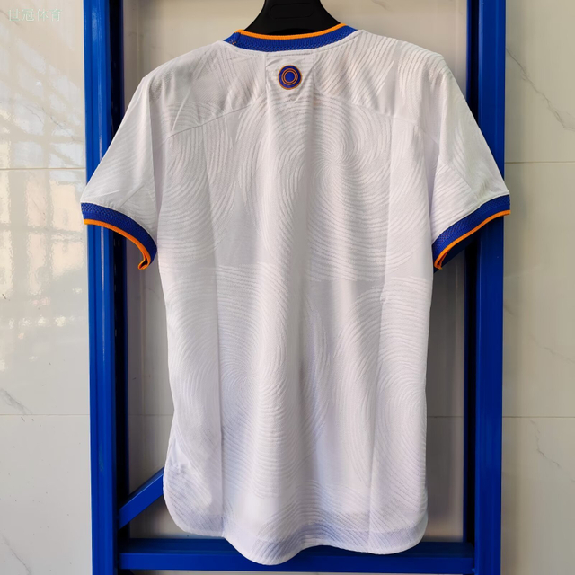21/22 Real Madrid Home Jersey - White with Blue/Orange Accents & Spiral Pattern