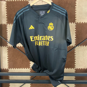 23/24 Real Madrid Second Away Jersey - Matte Black with Gold Accents & Henley Collar