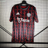24/25 Manchester United Away Pre-Match Training Jersey - Black-Red with Geometric Arrow Pattern & Tezos Sponsor