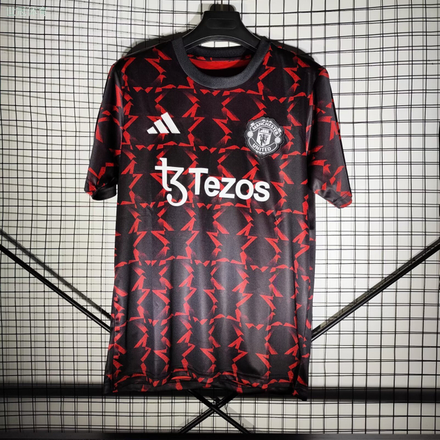 24/25 Manchester United Away Pre-Match Training Jersey - Black-Red with Geometric Arrow Pattern & Tezos Sponsor