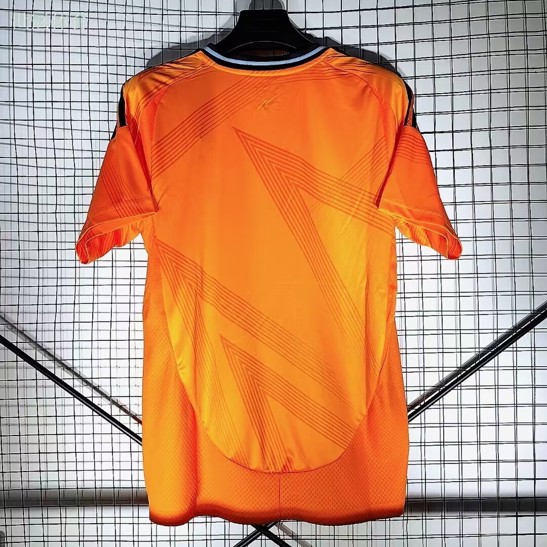 24/25 Real Madrid Away Jersey - Bright Orange with Dark Pattern & Navy Accents
